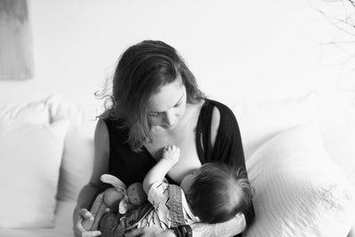Baby tenderly breast feeding