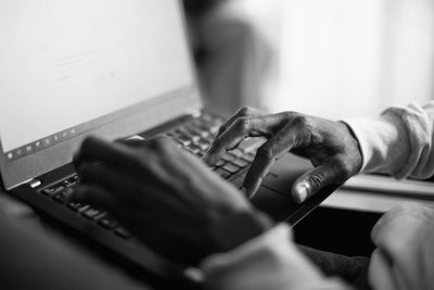 Close up of someone working on a computer