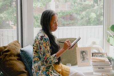 Taking notes by the window
